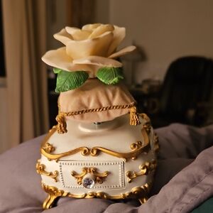 Avon Music Box Gold and Cream Decorative Box with Rose Accent On Pillow
